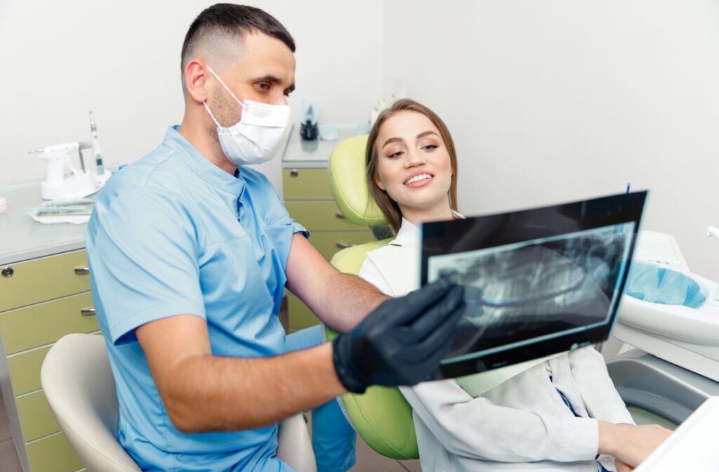 dentist showing patient their x-ray at a dental recall exam